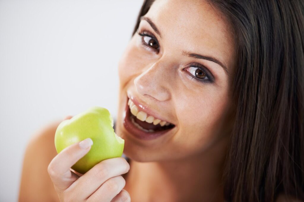 Woman portrait eating apple health wellness bite nutrition vitamins vegan female person fruit organic natural smile diet breakfast fresh digestion 590464 254264 Woman portrait eating apple health wellness bite nutrition vitamins vegan female person fruit organic natural smile diet breakfast fresh digestion 590464 254264