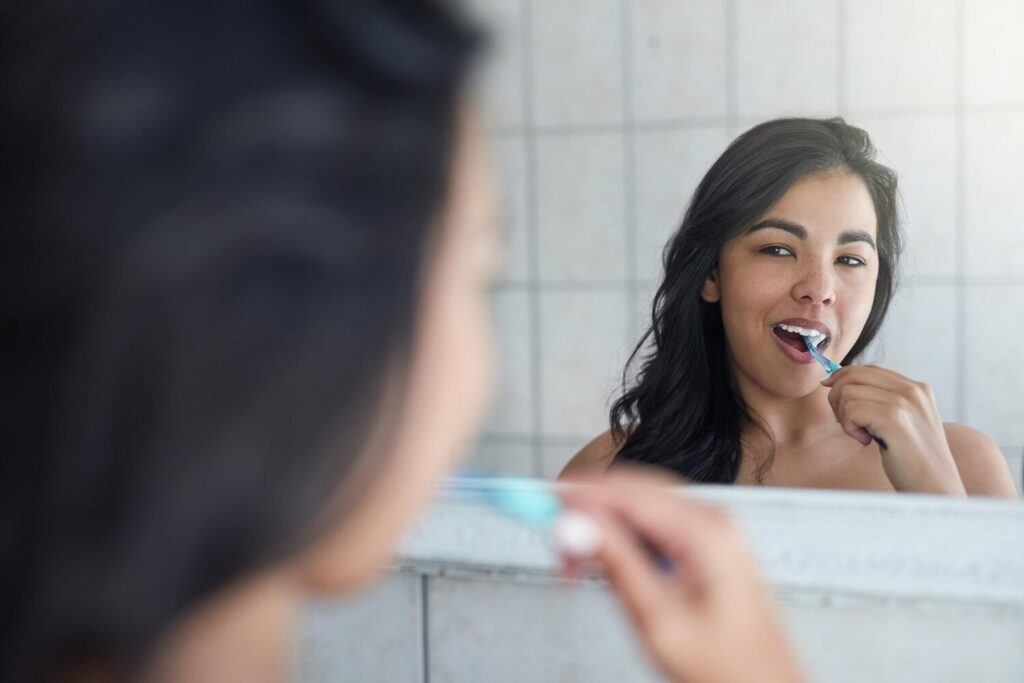 Brushing teeth dental hygiene with girl healthcare wellness fresh by mirror bathroom health tooth whitening gum care cleaning mouth with woman as morning routine home 590464 331682 Brushing teeth dental hygiene with girl healthcare wellness fresh by mirror bathroom health tooth whitening gum care cleaning mouth with woman as morning routine home 590464 331682