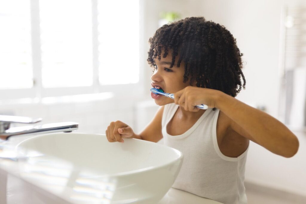 Cute hispanic boy brushing teeth by sink bathroom home 13339 328884 Cute hispanic boy brushing teeth by sink bathroom home 13339 328884